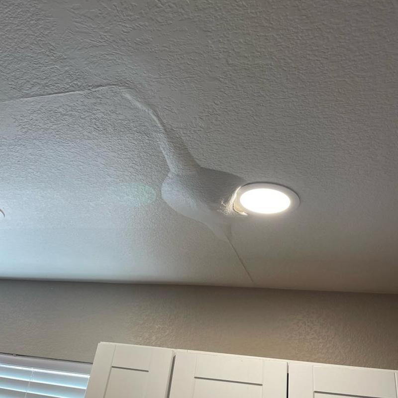 Ceiling drywall water damage near recessed light