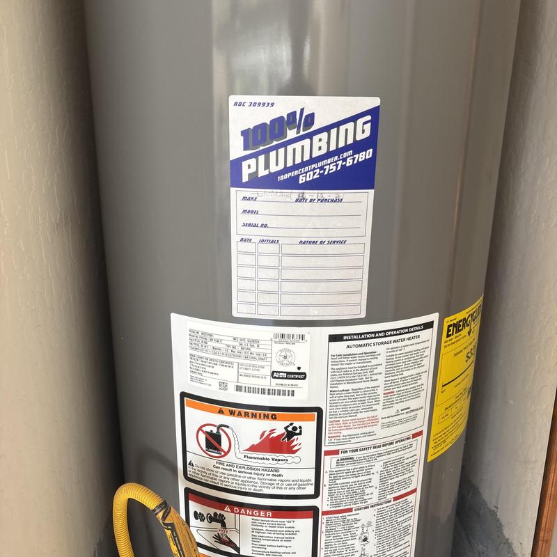 Water heater tank with maintenance service stickers Water heater tank with maintenance service stickers
