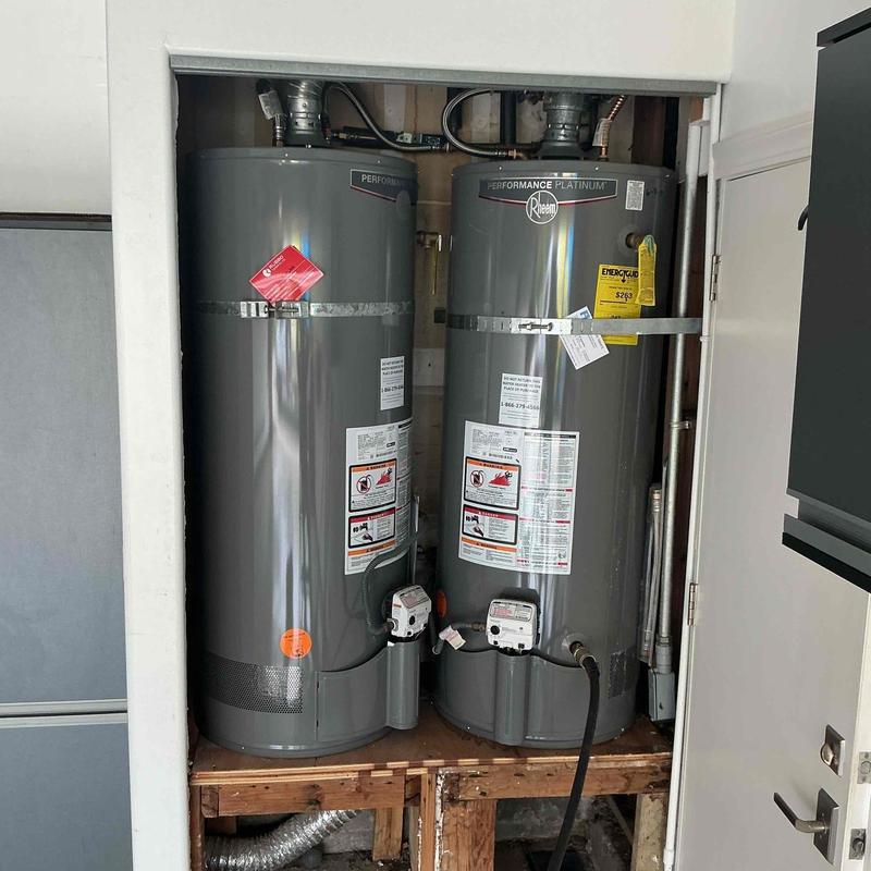 Water heaters with earthquake straps and drain pans installed