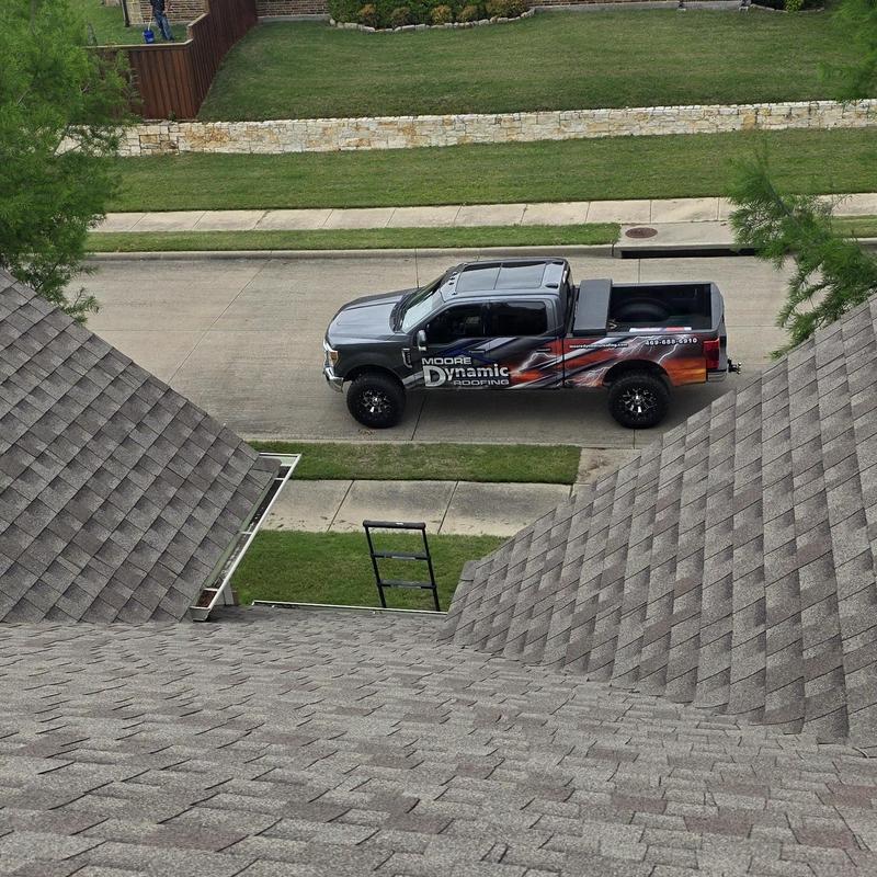 Architectural asphalt shingle roof with hail damage overview