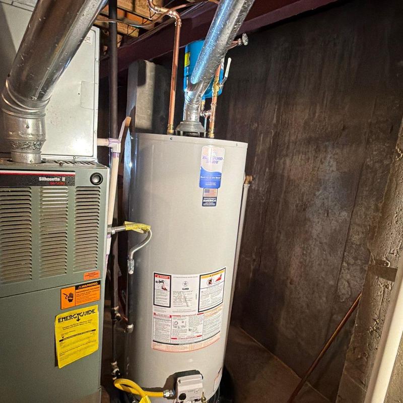 Water heater installation with code upgrades in basement