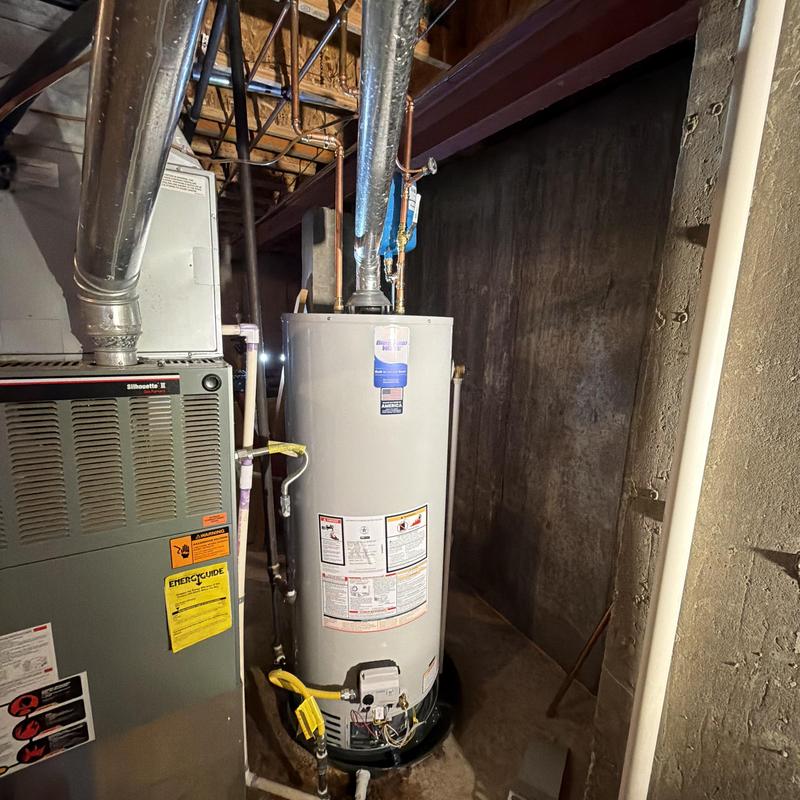 Water heater installation with code upgrades in basement