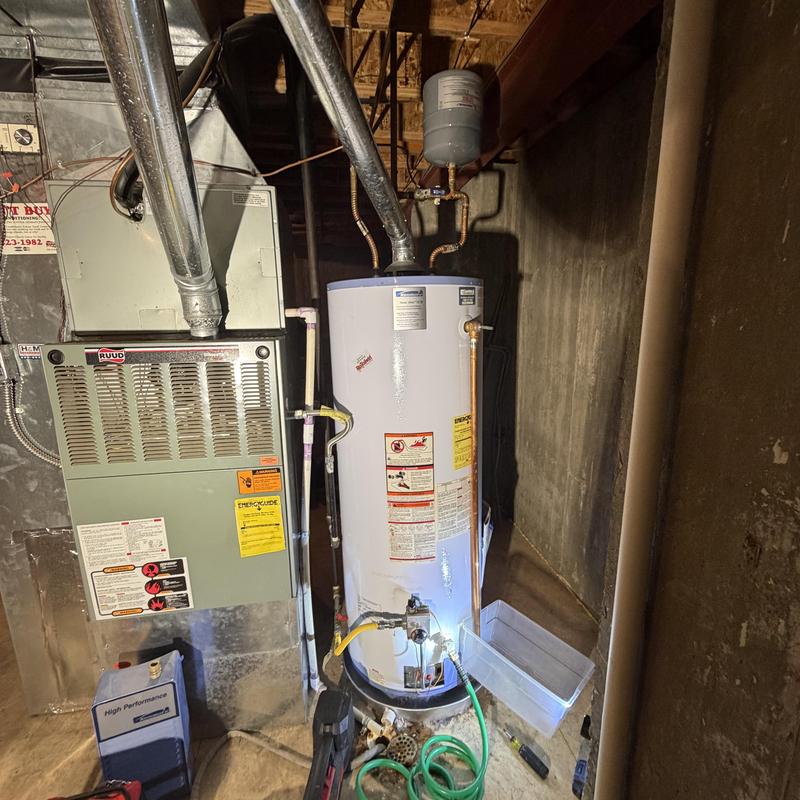 Water heater installation with code upgrades in basement