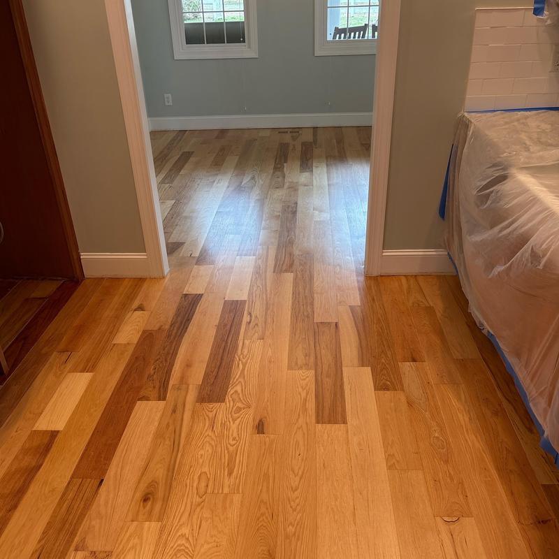 Hardwood flooring installation in home transition area Hardwood flooring installation in home transition area