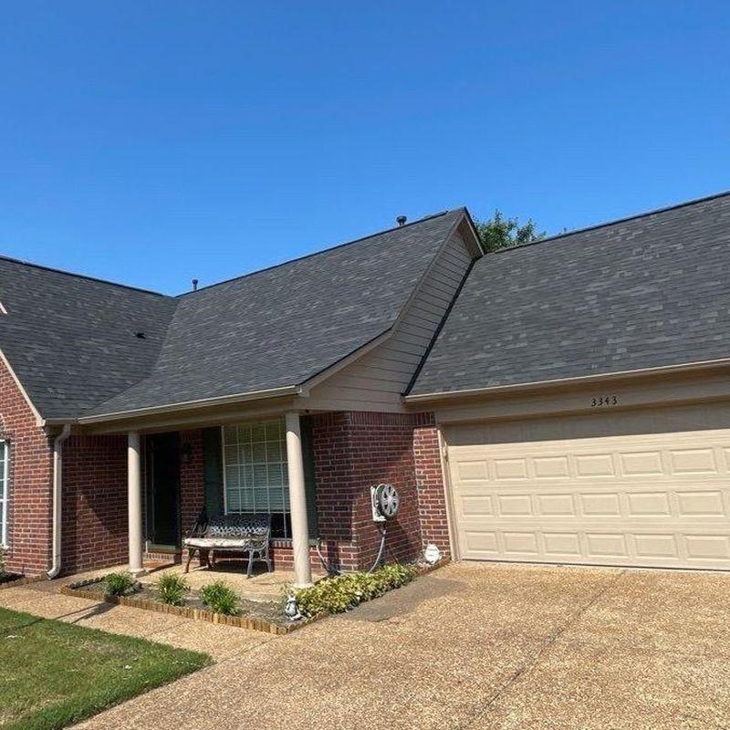 Asphalt shingle roof and brick home exterior in Bartlett