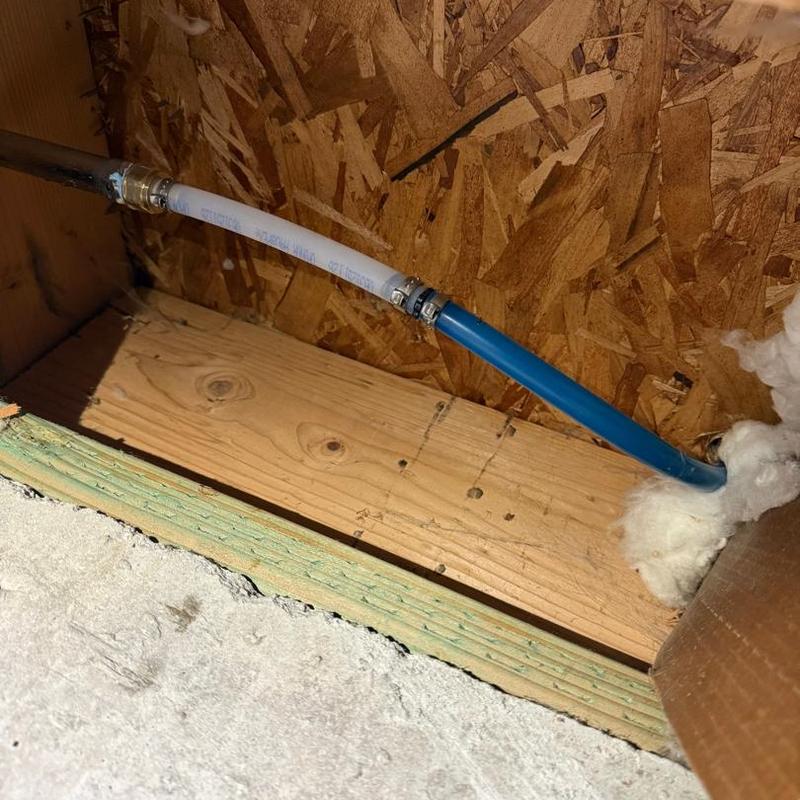 PEX water supply line installation under floor framing