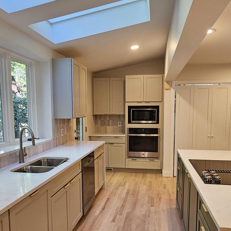 Kitchen cabinets and countertops with sink and appliances