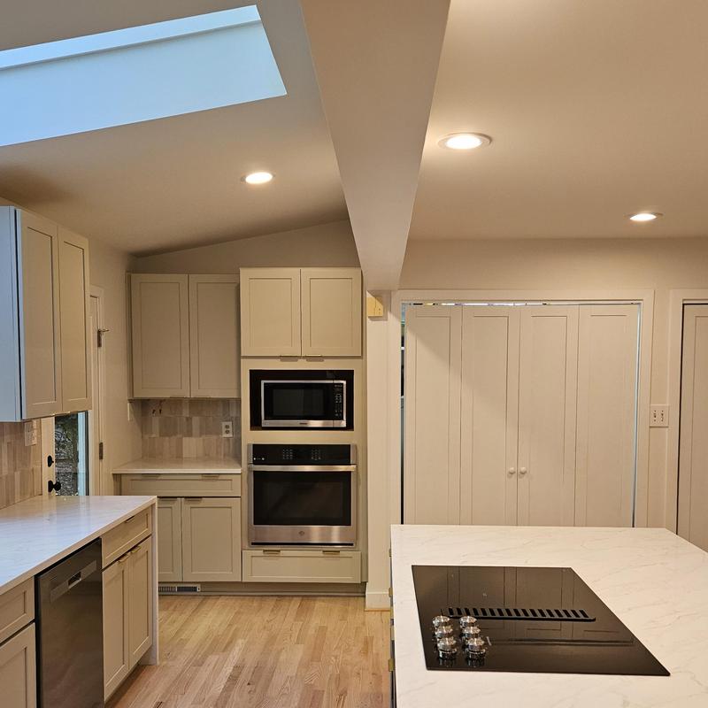 Kitchen cooktop and built-in oven with cabinetry