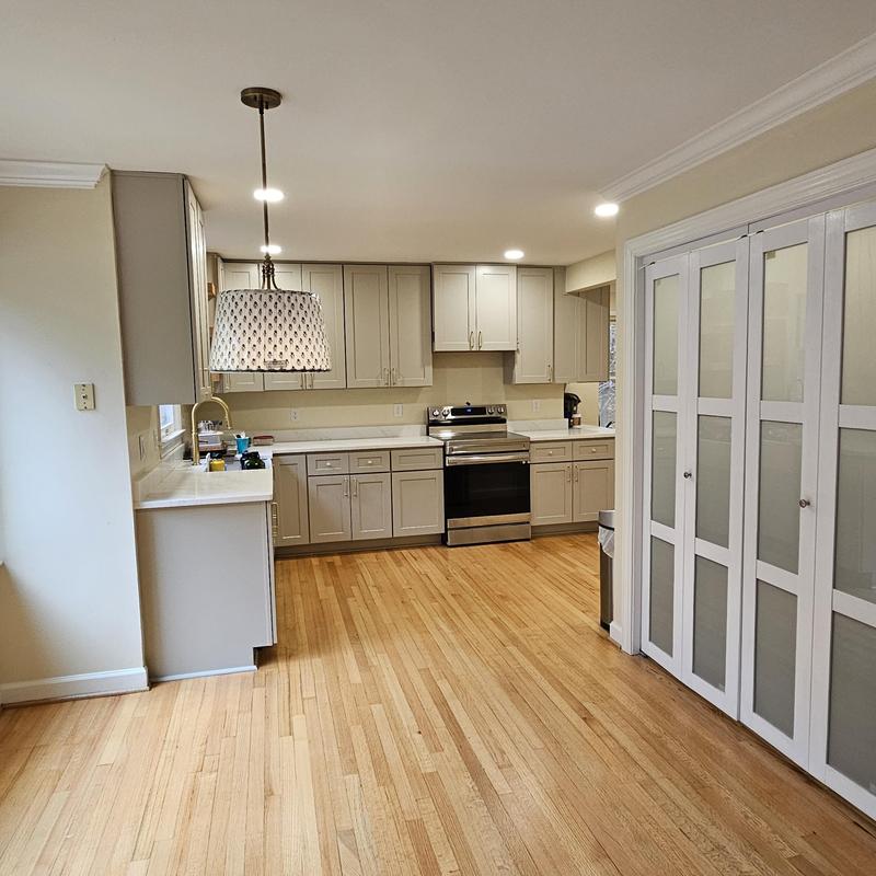 Kitchen cabinetry and hardwood floor installation
