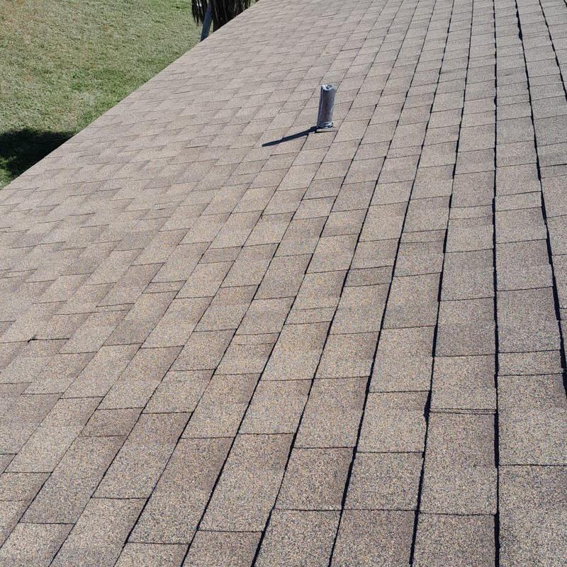 Shingle roof with repaired leak near vent pipe
