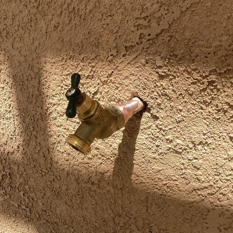 Hose bib installation on stucco wall with copper piping