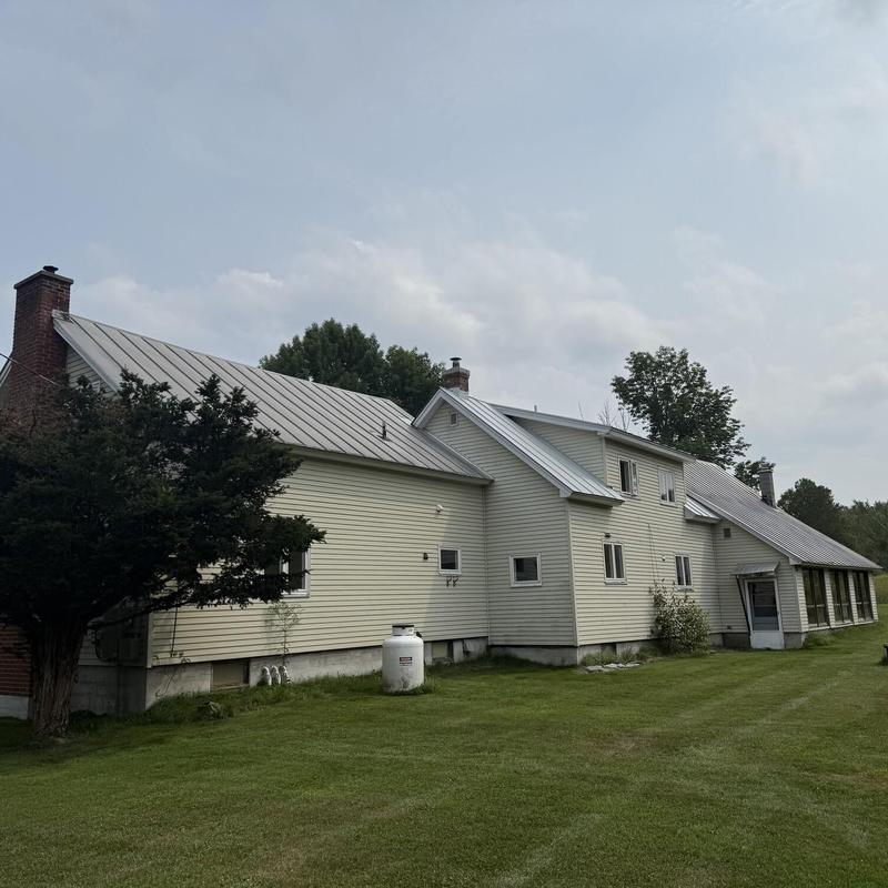 Standing seam metal roof with fresh coating in Vermont