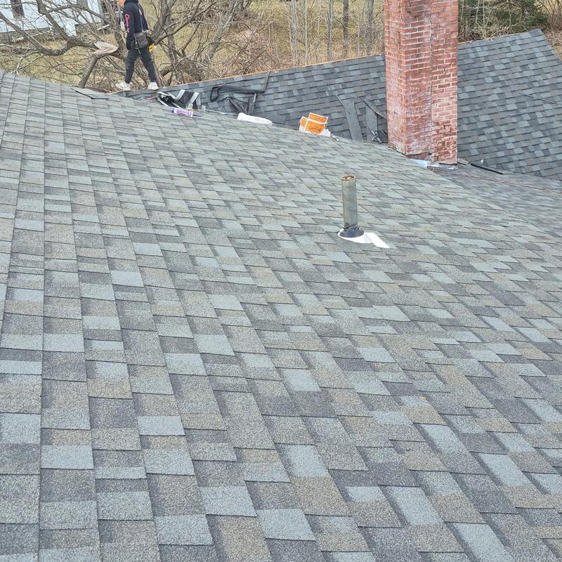Asphalt shingle roof with chimney and vent pipe