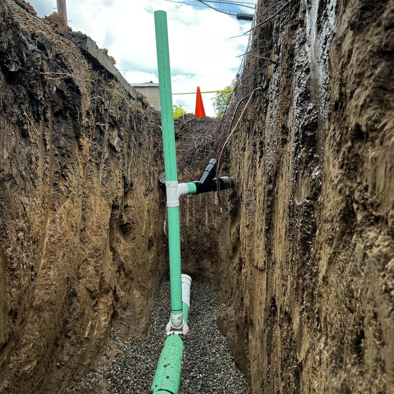 8-inch sewer pipe installation in trench with gravel bed