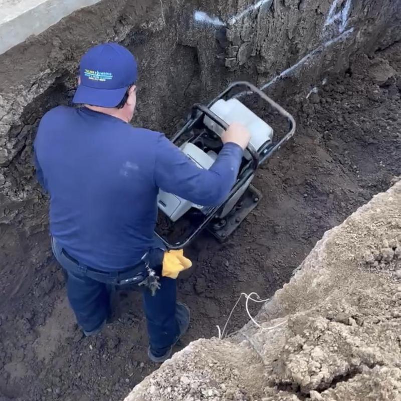 8-inch sewer pipe bed compaction with tamper in trench
