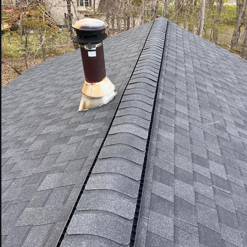New asphalt shingle roof with vent pipe flashing