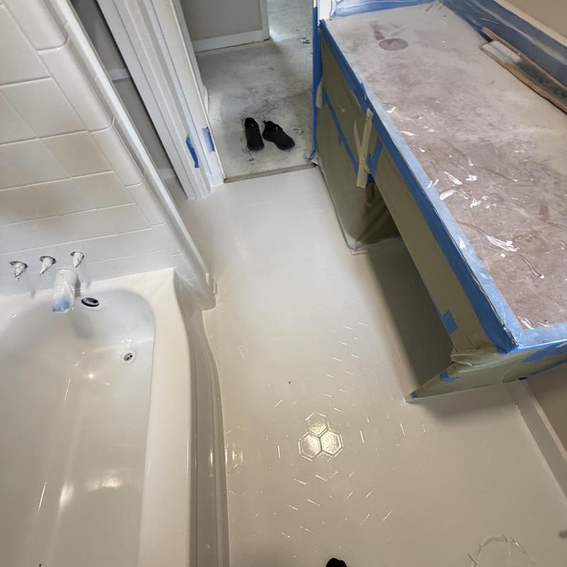 Bathtub and hex tile refinishing in bathroom