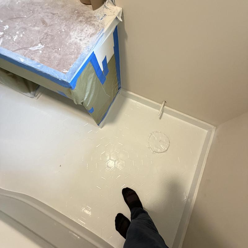 Tile floor refinishing with protective masking tape