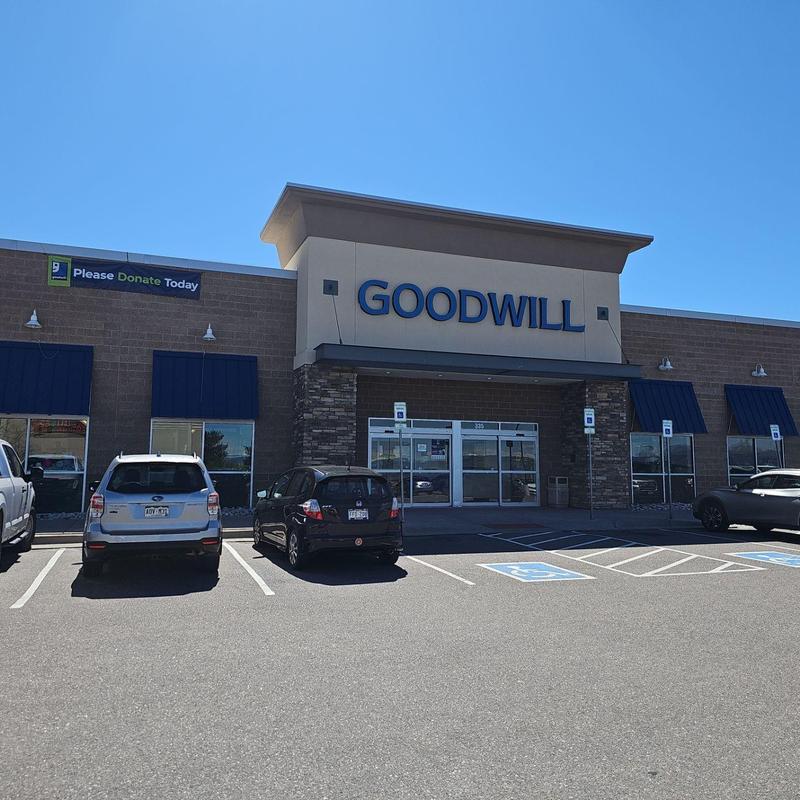 TPO flat roof inspection at Goodwill facility exterior