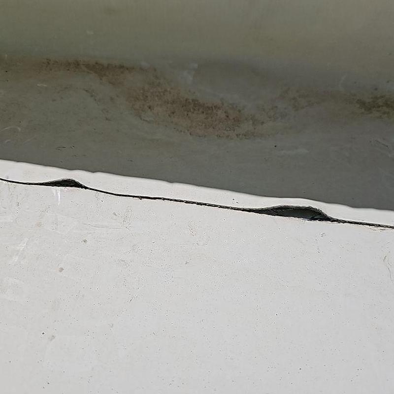 TPO roofing membrane seam damage close-up