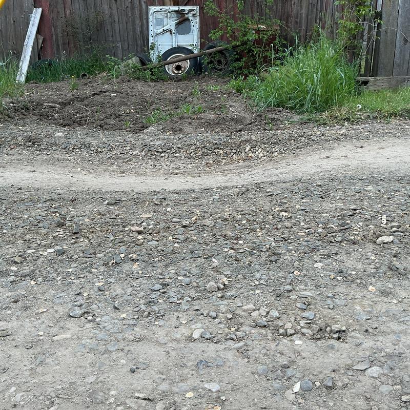 Excavation site with settled and sunk gravel patch