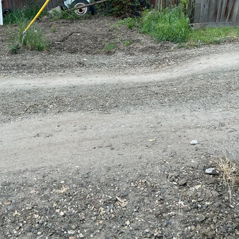 Excavation area with settled soil needing compaction