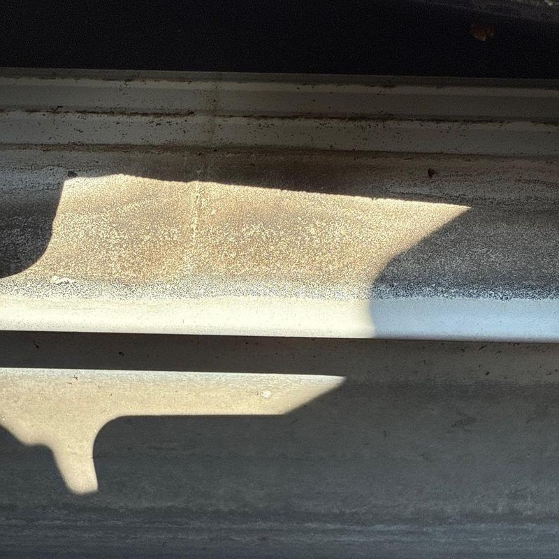 Roof flashing with hail damage and granule loss