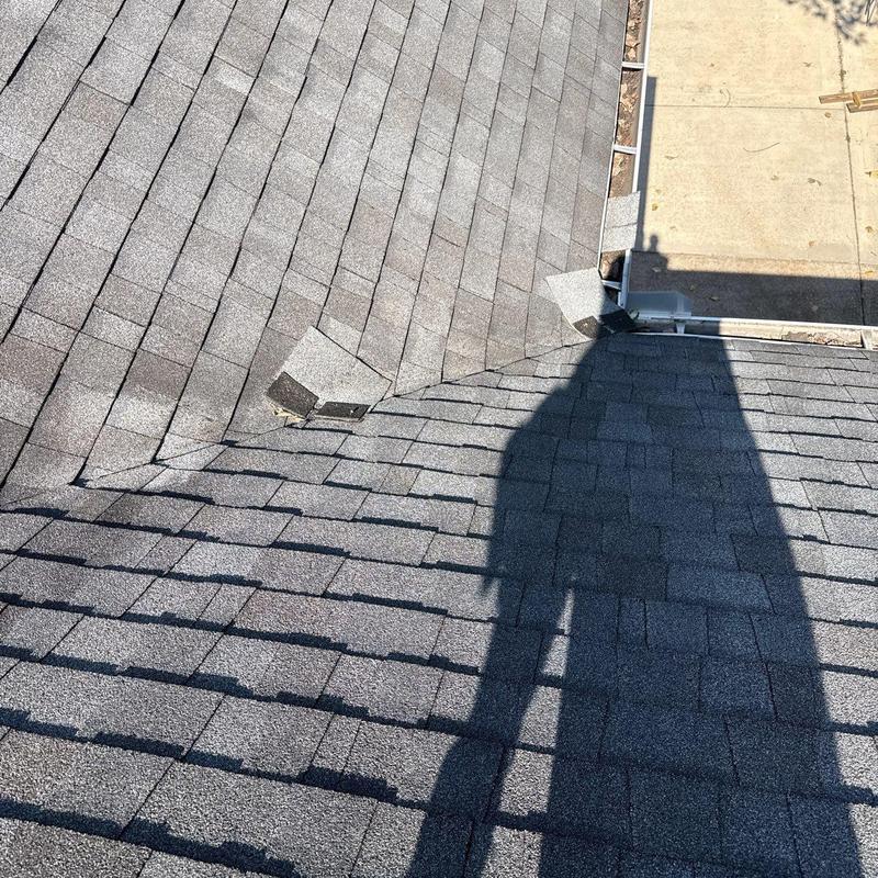 Roof shingles showing hail damage and granule loss