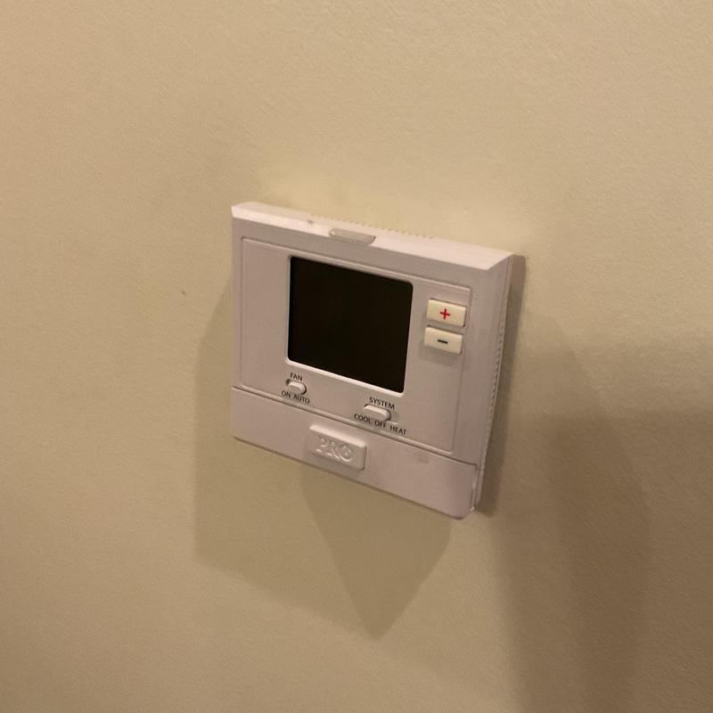Thermostat on wall powering HVAC system off