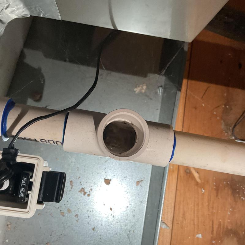 Coil drain line with overflow switch on HVAC system
