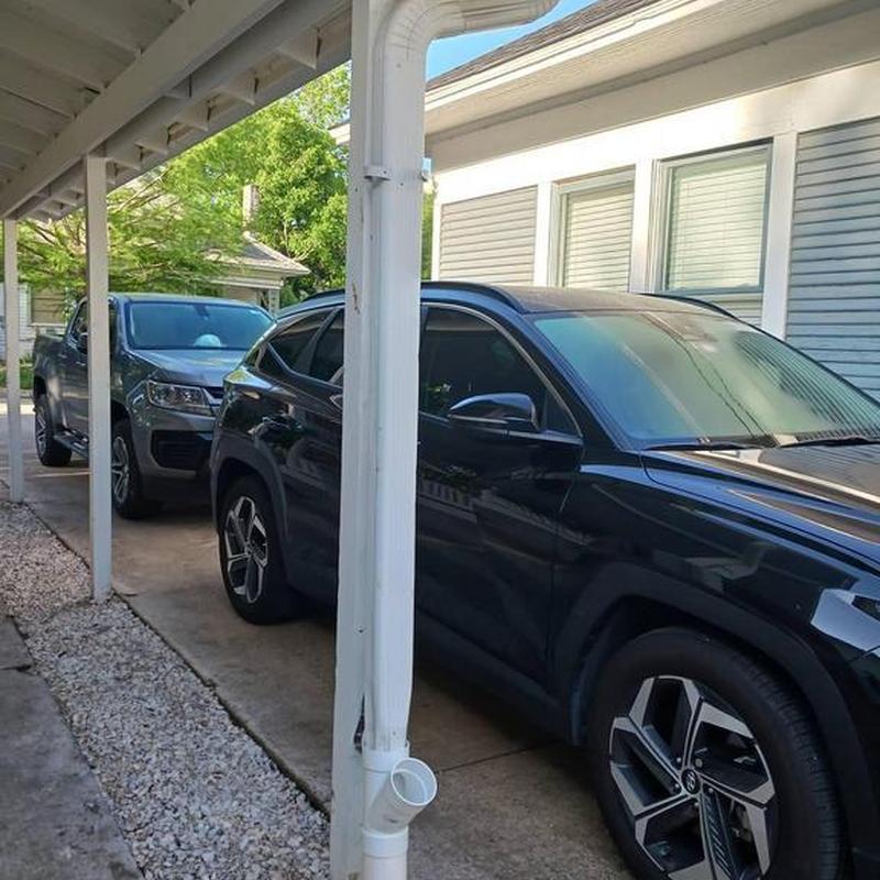 Gutter downspout connected to French drain system