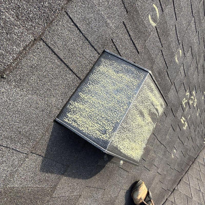 Roof shingles with hail damage and chalk markings