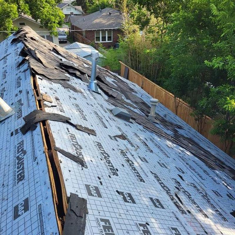 GAF Felt underlayment with torn shingles on roof
