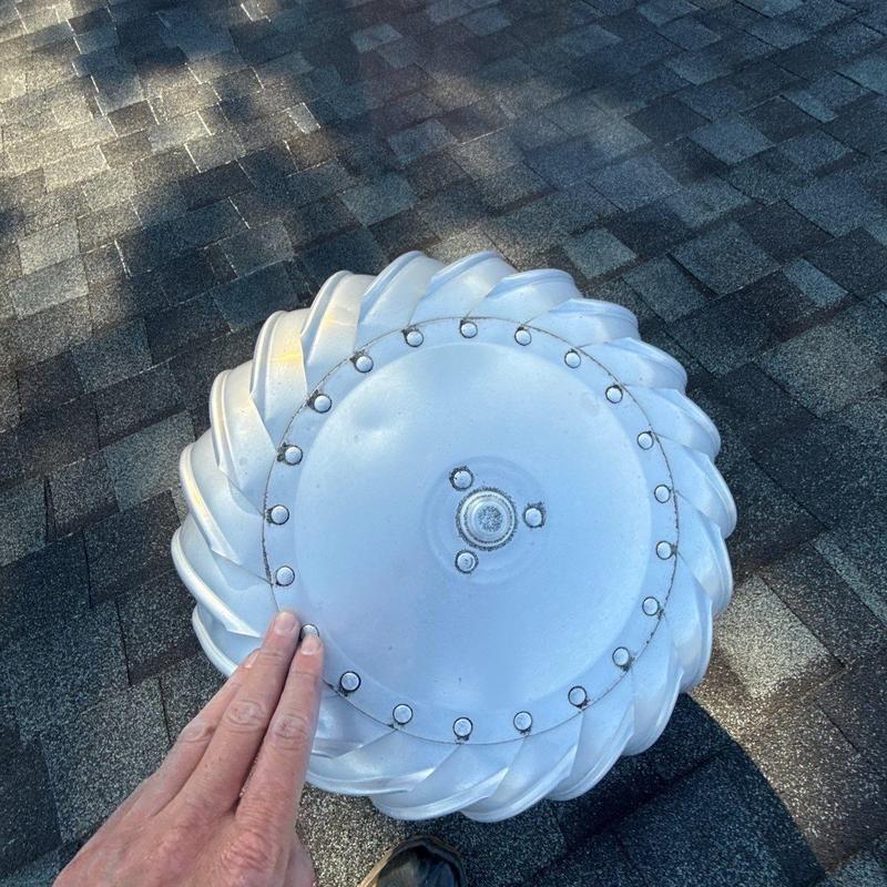 Roof turbine vent installed on asphalt shingle roof