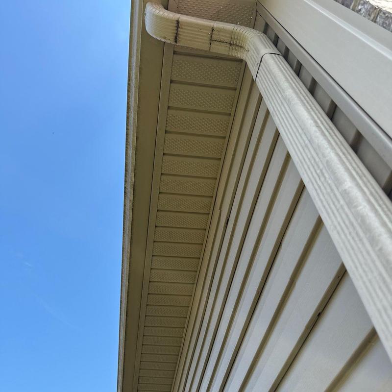 Downspout and soffit system on house exterior