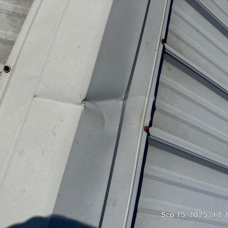 Metal roof panel dent with hail damage inspection
