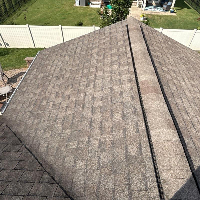 Asphalt shingle roof with hail damage and granule loss