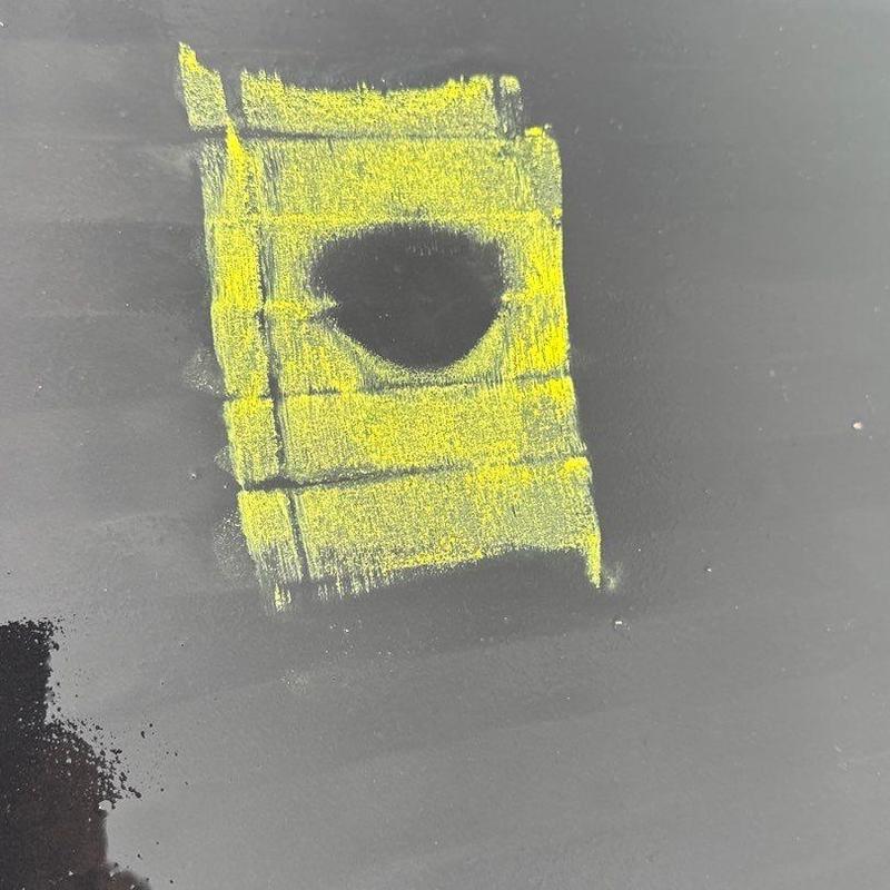 Roof underlayment with marked hail damage spot