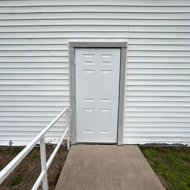 Exterior door trim with fresh paint and new caulking