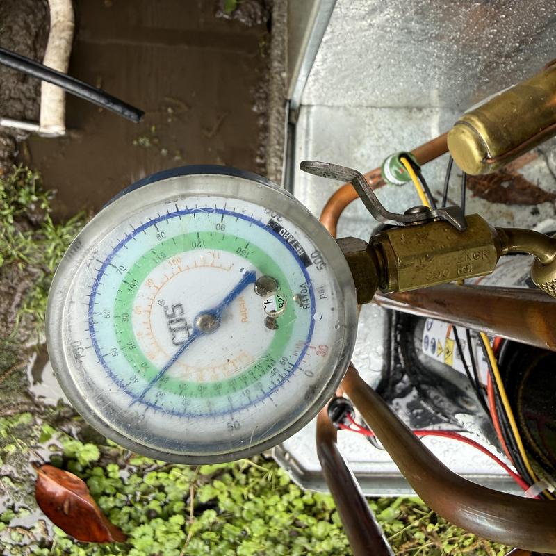 HVAC system Freon pressure gauge and copper tubing HVAC system Freon pressure gauge and copper tubing