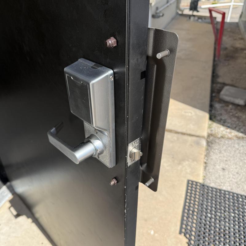 Keypad entry lock and latch protection plate on door