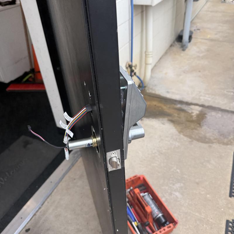 Keypad entry lock installation on metal service door