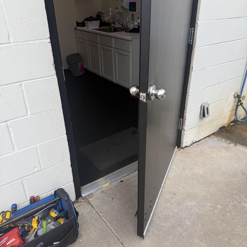 Service door with keypad lock and door closer installation