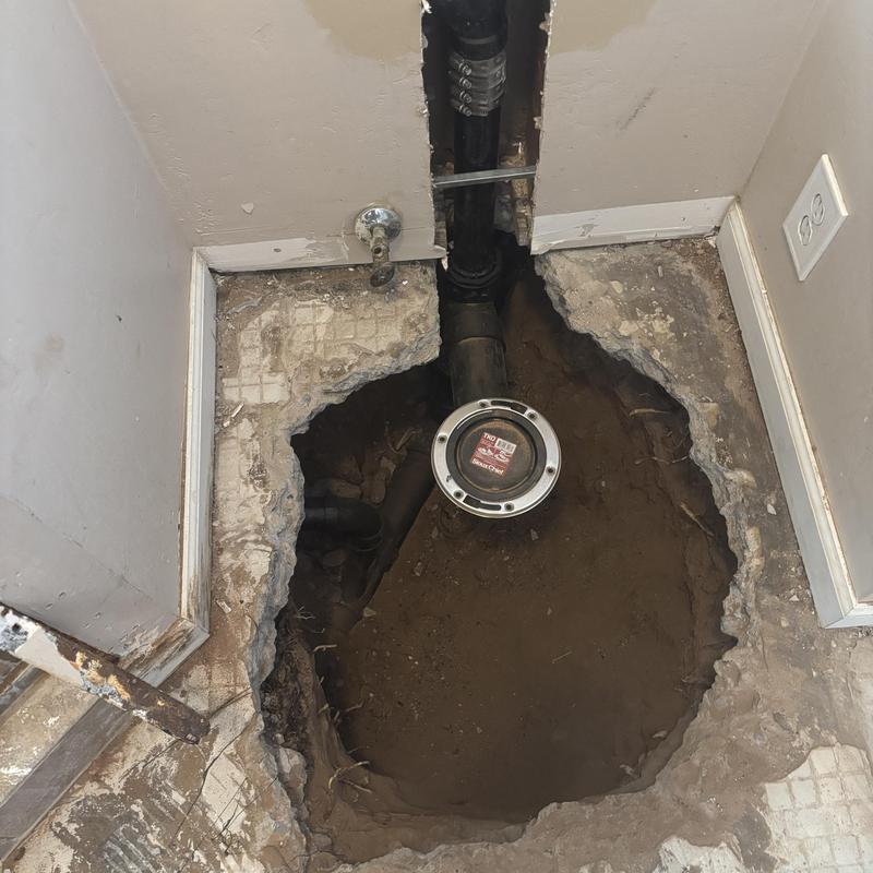 Sewer cleanout pipe with exposed floor excavation Sewer cleanout pipe with exposed floor excavation