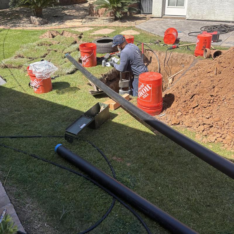 Underground PVC pipe installation in residential yard Underground PVC pipe installation in residential yard