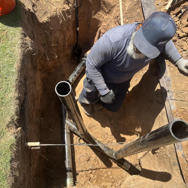Steel drainage pipes installation in ground trench Steel drainage pipes installation in ground trench