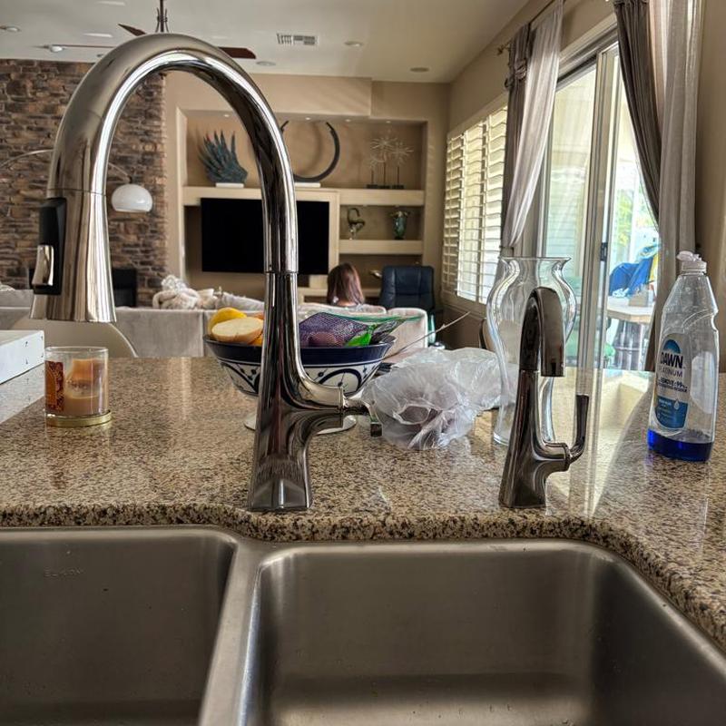 Kitchen sink Kohler faucet installation on granite counter