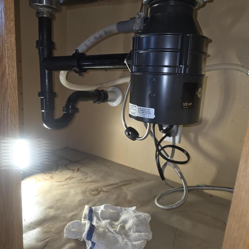 Garbage disposal and P-trap plumbing under sink