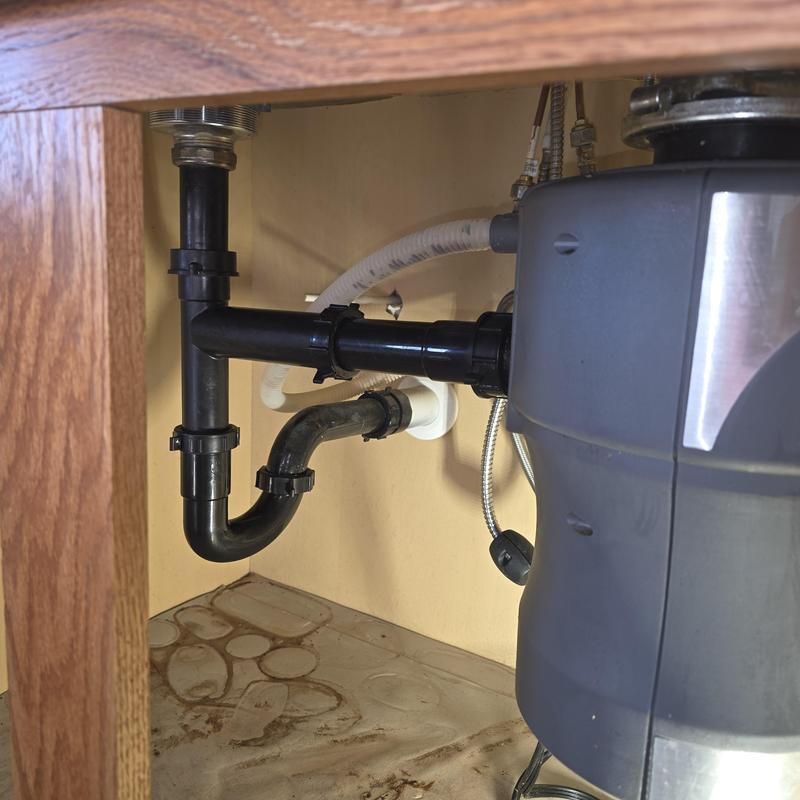 Garbage disposal and p-trap plumbing under sink