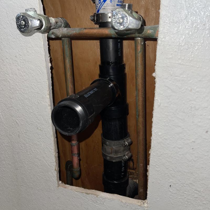 1 1/2 inch ABS drain line with fittings and clamp